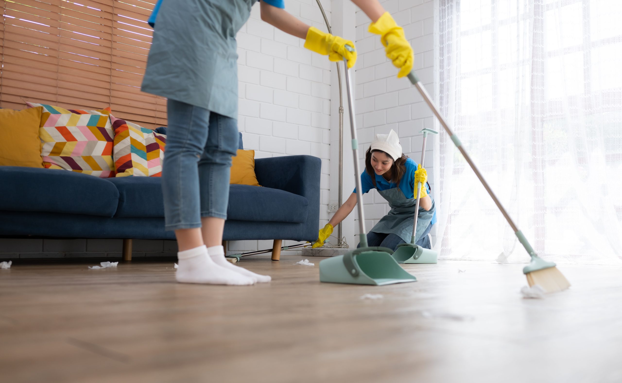 Cleaning service. Dark-haired woman wearing a white hat and yell